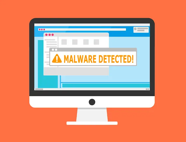 Computer screen displaying a malware detection warning message with an orange alert icon.