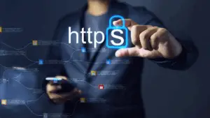 Business professional using a smartphone with HTTPS encryption symbol representing secure web connections  Brivy IT